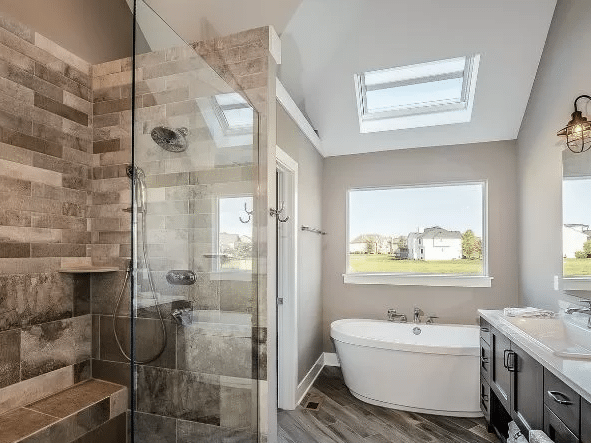 Bathroom with a freestanding tub and tiled shower